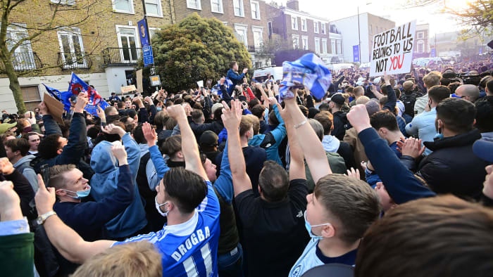Chelsea fans celebrate the club's Super League withdrawal